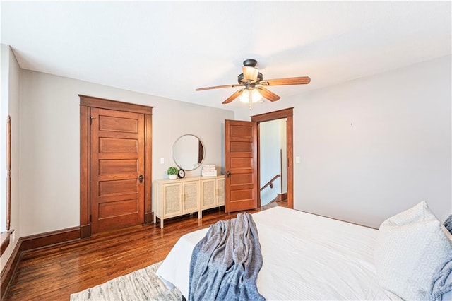 bedroom featuring ceiling fan and dark hardwood / wood-style flooring