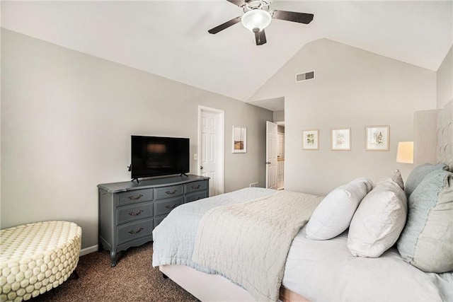 bedroom with ceiling fan, lofted ceiling, and dark colored carpet