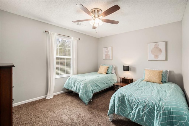 bedroom featuring ceiling fan, carpet flooring, and a textured ceiling