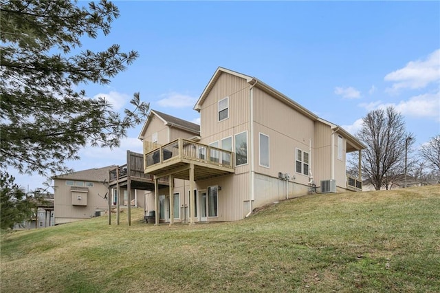 back of house with a wooden deck, a yard, and central AC unit