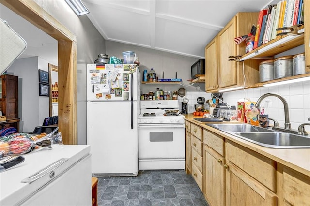 kitchen with backsplash, light brown cabinetry, sink, and white appliances