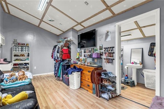 interior space with hardwood / wood-style flooring and sink