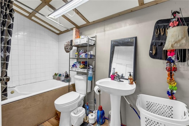 full bathroom with shower / bath combination with curtain, toilet, and sink