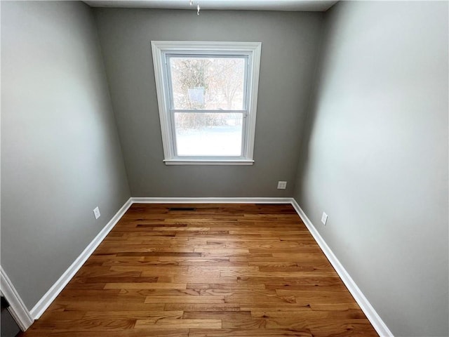 empty room featuring hardwood / wood-style floors