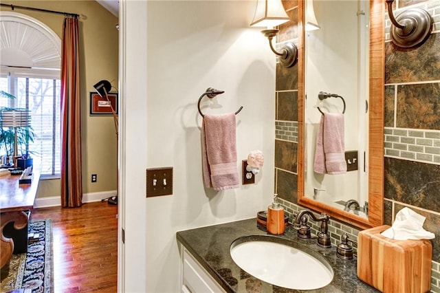 bathroom with vanity and hardwood / wood-style floors