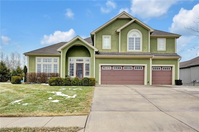 view of front facade featuring a garage and a front yard