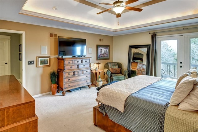 carpeted bedroom with crown molding, access to outside, a raised ceiling, and ceiling fan