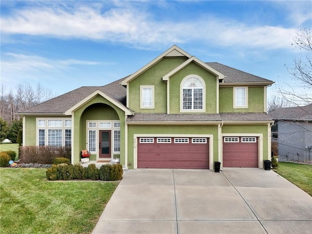 view of front of home featuring a garage and a front lawn