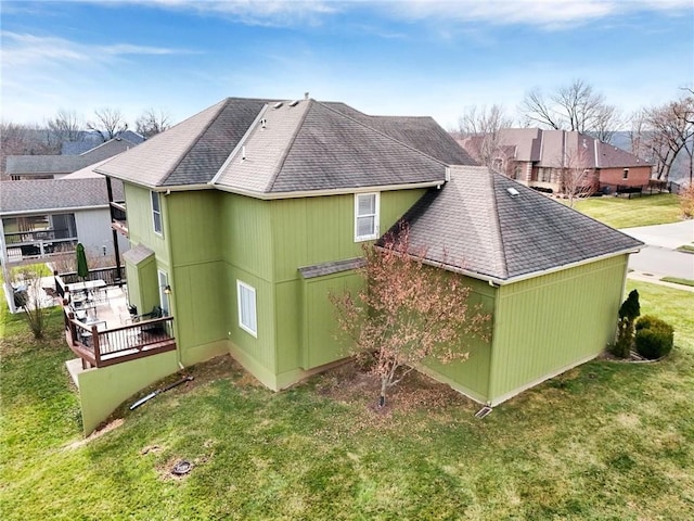 view of side of home featuring a lawn