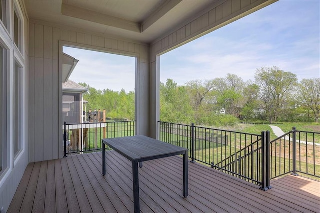 wooden deck featuring a yard