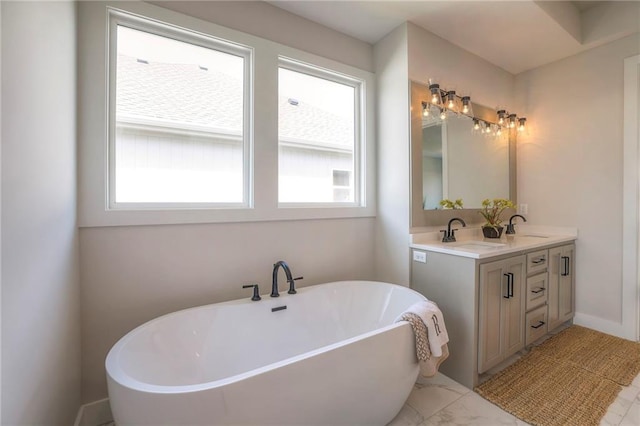 bathroom featuring a bathing tub and vanity