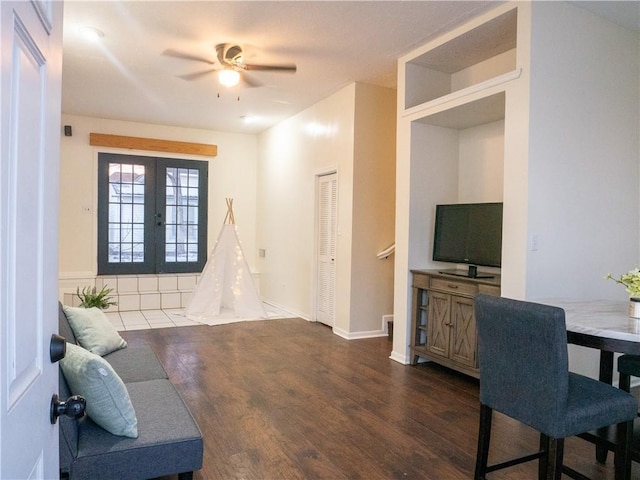 interior space featuring ceiling fan, dark hardwood / wood-style flooring, and french doors