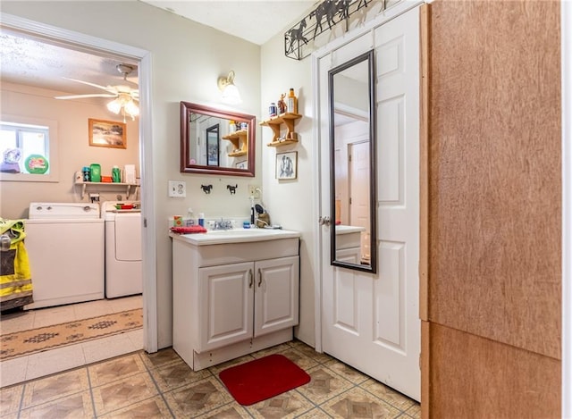 bathroom featuring washer and dryer, vanity, tile patterned flooring, and ceiling fan