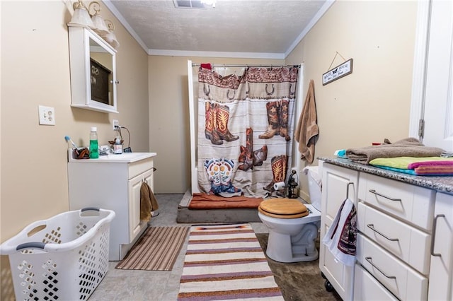 bathroom featuring a textured ceiling, crown molding, vanity, and toilet