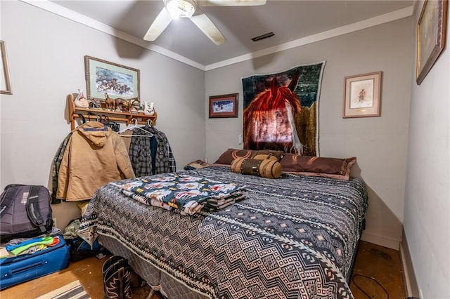 bedroom featuring ceiling fan and crown molding