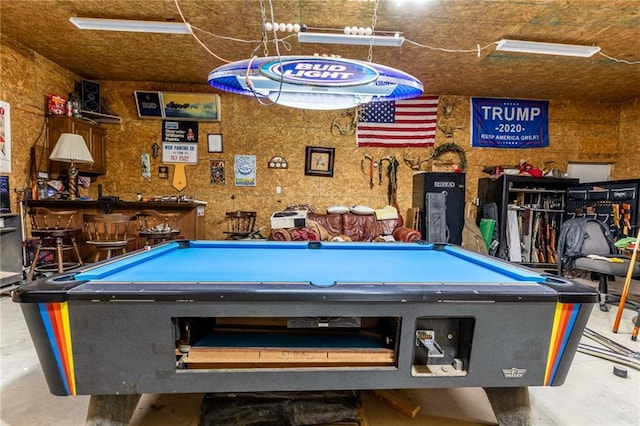 playroom with bar area, billiards, and concrete flooring