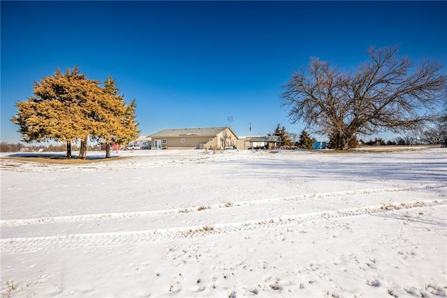 view of yard layered in snow