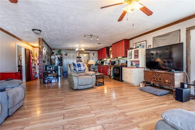 living room featuring ceiling fan with notable chandelier, ornamental molding, a textured ceiling, and light wood-type flooring