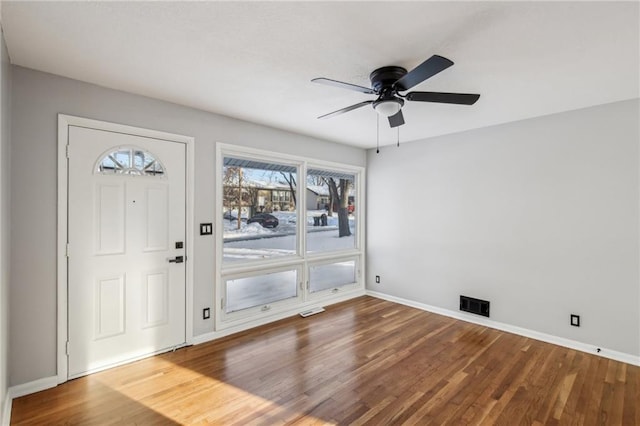 entrance foyer with ceiling fan and wood-type flooring