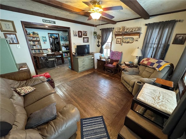 living room with beamed ceiling, hardwood / wood-style floors, and ceiling fan