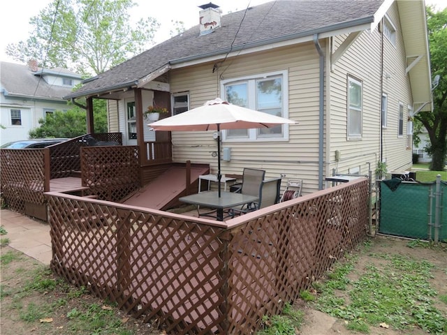 back of property featuring a deck