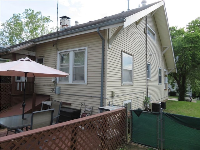 view of side of property featuring cooling unit