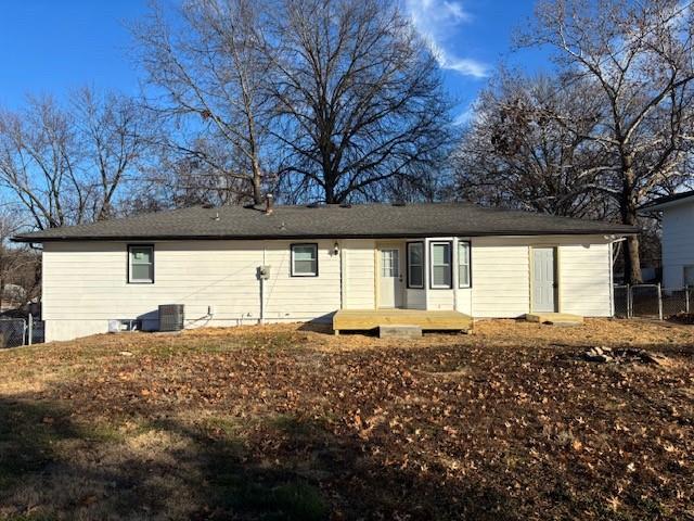 back of house with a wooden deck