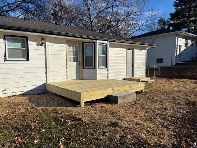 back of house with a wooden deck