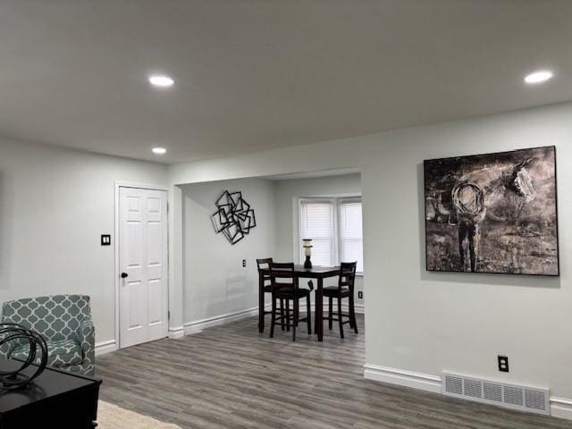 dining area with dark hardwood / wood-style floors