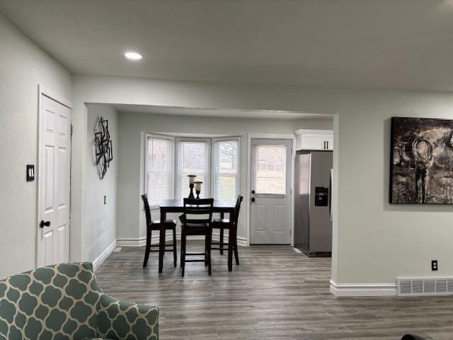 dining space with dark wood-type flooring