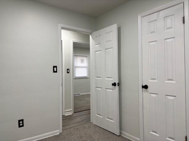 corridor with carpet floors