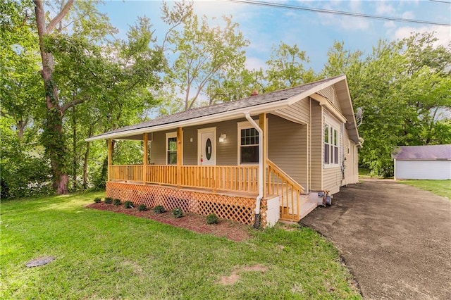 view of front facade with covered porch and a front lawn