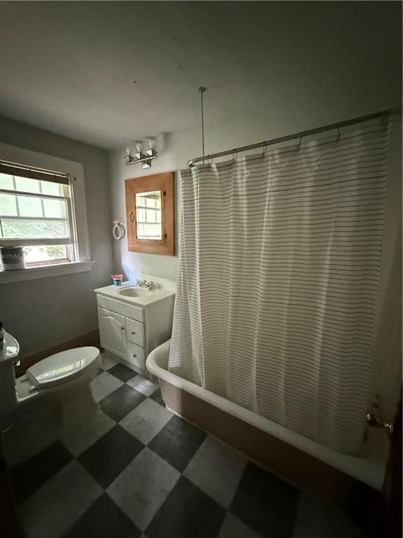 211 N Mulberry St, Maryville, MO 64468 - full bath with vanity, tile patterned floors, and shower / bath combo with shower curtain