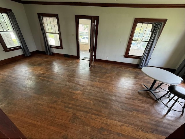 211 N Mulberry St, Maryville, MO 64468 - unfurnished room featuring crown molding and dark wood finished floors