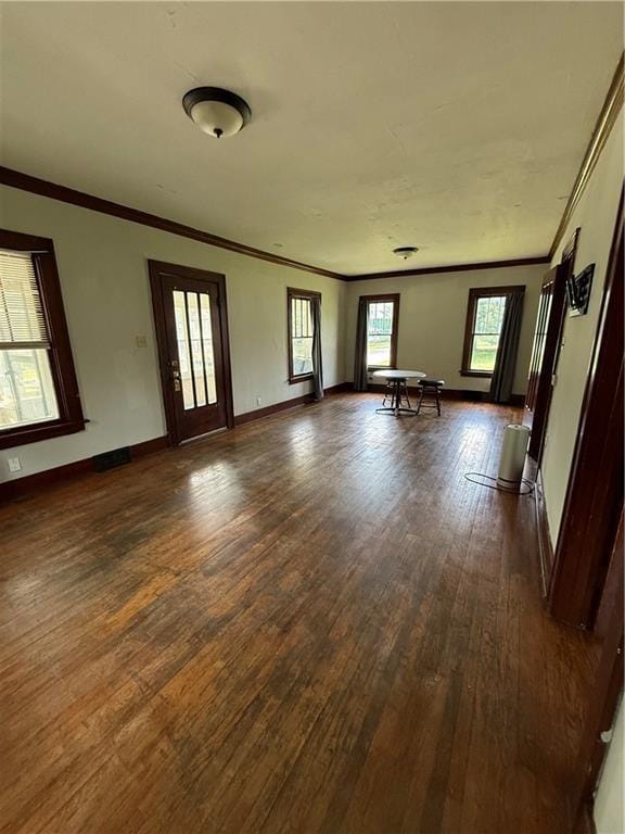 211 N Mulberry St, Maryville, MO 64468 - spare room with dark wood-type flooring and crown molding