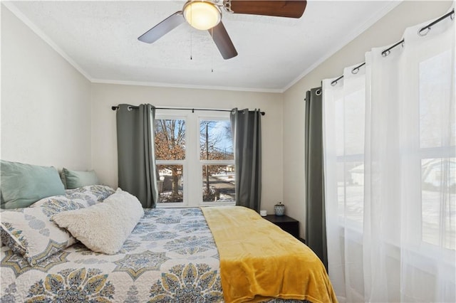 bedroom featuring ceiling fan and crown molding