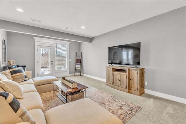 living room featuring light colored carpet