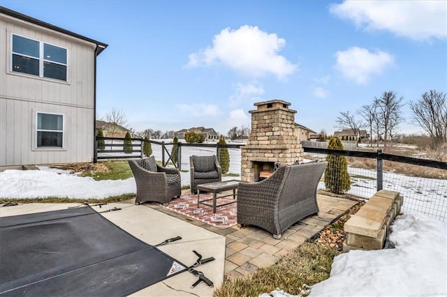 view of patio / terrace with an outdoor brick fireplace