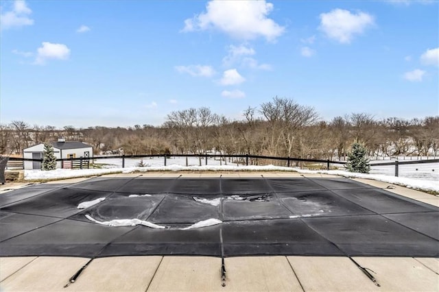 view of snow covered pool