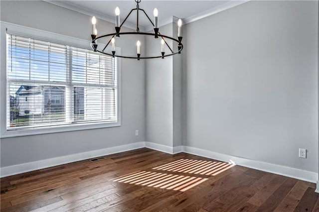 unfurnished dining area with crown molding, dark hardwood / wood-style flooring, and a chandelier