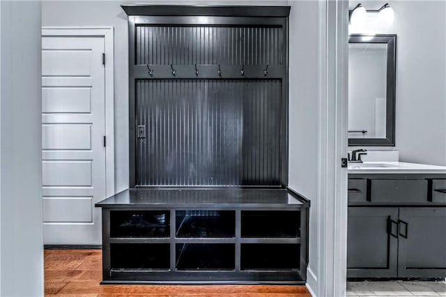 mudroom featuring hardwood / wood-style flooring and sink