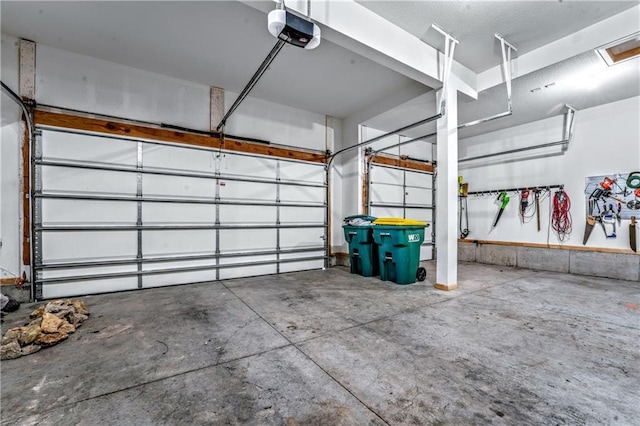 garage featuring a garage door opener