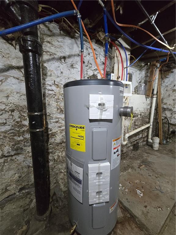 utility room with water heater