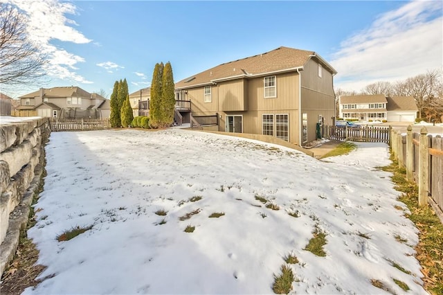 view of snow covered house