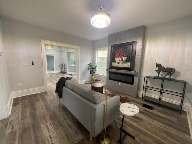 living room with dark hardwood / wood-style floors