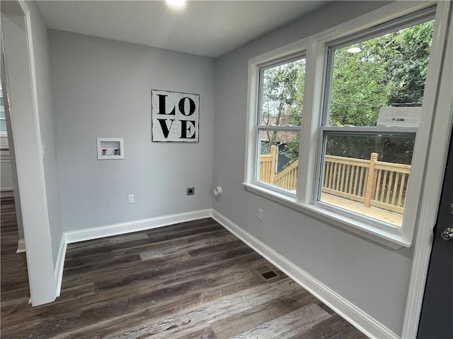 laundry room with dark wood-type flooring, washer hookup, and hookup for an electric dryer