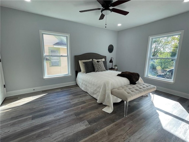 bedroom featuring ceiling fan and dark hardwood / wood-style flooring