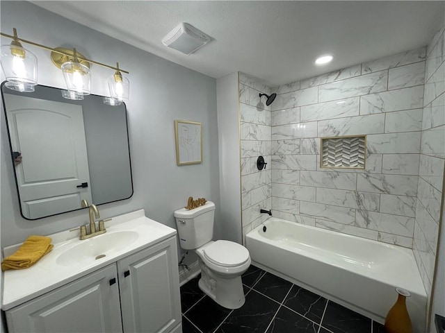 full bathroom with tiled shower / bath combo, toilet, and vanity