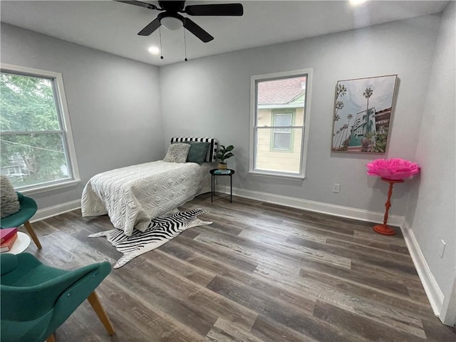 bedroom featuring ceiling fan and dark hardwood / wood-style flooring