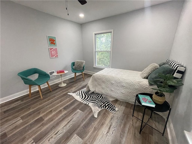 bedroom featuring ceiling fan and dark hardwood / wood-style floors